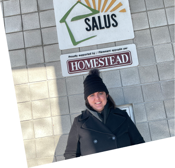 Claire in front of Salus sign
